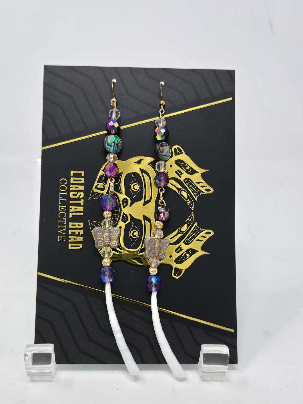 Purple dentalium dangles by Jenna Lancaster