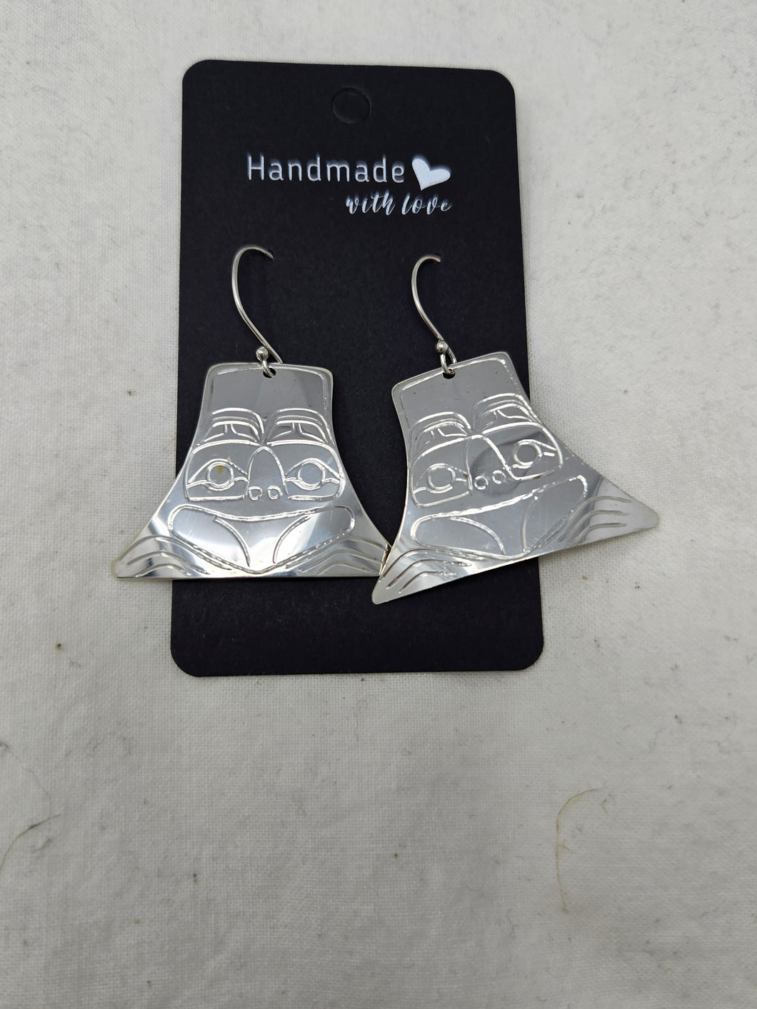 Silver hat frog design earrings by Valerie Lancaster